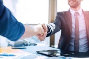 Executive And Assistant Handshake